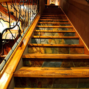 Design ideas for a medium sized classic wood l-shaped metal railing staircase in Cleveland with slate risers.