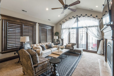 This is an example of a mid-sized traditional living room in Salt Lake City with beige walls, carpet, a standard fireplace, a wall-mounted tv and beige floor.