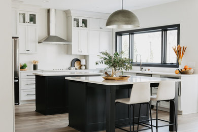 Eat-in kitchen - large contemporary u-shaped vinyl floor and brown floor eat-in kitchen idea in Other with an undermount sink, shaker cabinets, gray cabinets, quartz countertops, white backsplash, quartz backsplash, stainless steel appliances, two islands and white countertops