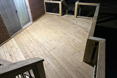 Example of an arts and crafts deck design in Other