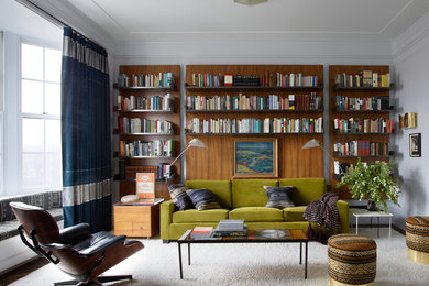 Inspiration for a contemporary dark wood floor and brown floor family room remodel in New York with white walls