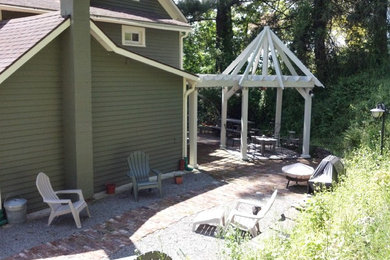 Mid-sized rustic green one-story wood gable roof idea in Other