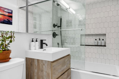 Inspiration for a mid-sized contemporary master white tile and ceramic tile ceramic tile, gray floor and single-sink bathroom remodel in New York with furniture-like cabinets, brown cabinets, a one-piece toilet, yellow walls, an integrated sink, quartz countertops, white countertops and a floating vanity