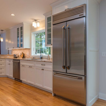 Modern Kitchen with White Flat Panel Shaker Cabinets & Natural Stone Backsplash