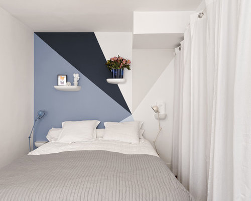 Idées déco pour une petite chambre contemporaine avec un mur blanc.