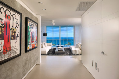 Family room - mid-sized contemporary open concept family room idea in Miami with white walls