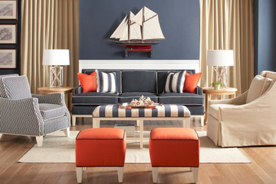 Example of a large enclosed light wood floor living room design in Other with blue walls and no tv