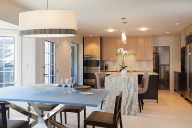 Kitchen - kitchen idea in Boston with stainless steel appliances and an island