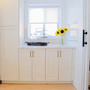 White Kitchen Sideboard Beneath a Bright Window | The Junction