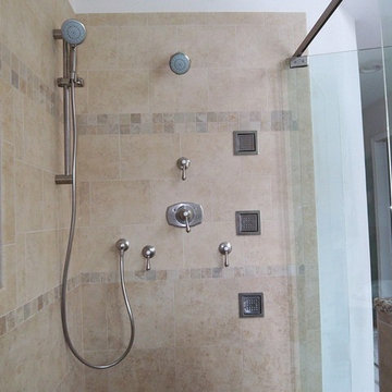 Kohler body sprays with Grohe shower heads and trim