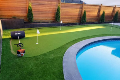 Photo of a small contemporary full sun backyard outdoor basketball/tennis/multi-game court in Vancouver for summer.