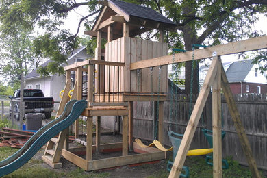 Example of a mid-sized gender-neutral kids' room design in Other