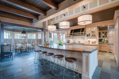 Inspiration for a large transitional u-shaped slate floor and gray floor eat-in kitchen remodel in Boston with an undermount sink, shaker cabinets, light wood cabinets, quartz countertops, white backsplash, stone slab backsplash, paneled appliances and an island