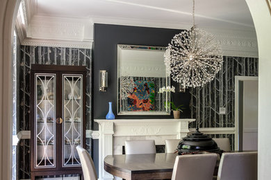 Large trendy medium tone wood floor enclosed dining room photo in Raleigh with gray walls