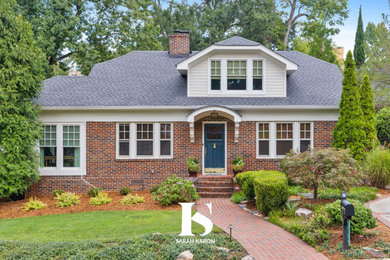 Mid-sized elegant two-story brick and clapboard house exterior photo in Atlanta