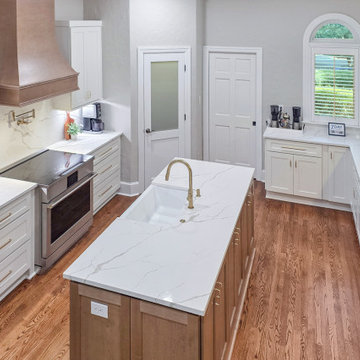 Bright Kitchen Layout with Quartz Island and Custom Wood Hood