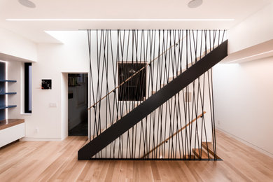 Mid-sized minimalist wooden straight open and metal railing staircase photo in San Francisco