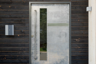 Example of a danish exterior home design in Denver
