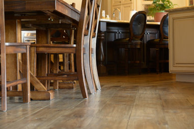 Family room - huge traditional open concept medium tone wood floor family room idea in San Francisco with a bar