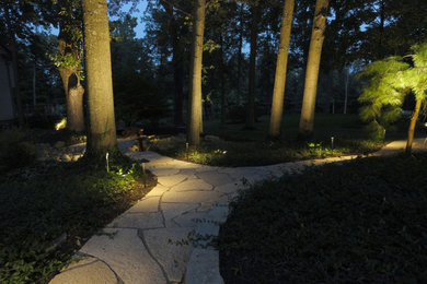 Large country backyard formal garden in Columbus with a garden path and natural stone pavers.