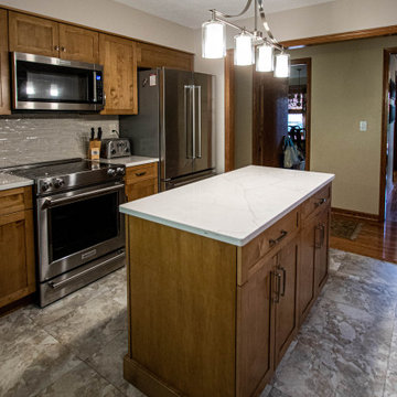 Toffee Stain Shaker Door Kitchen with Calacatta Valetin Quartz Countertops