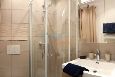 Design ideas for a small contemporary cloakroom in Nice with flat-panel cabinets, light wood cabinets, a wall mounted toilet, beige tiles, ceramic tiles, beige walls, ceramic flooring, a console sink, solid surface worktops, grey floors, white worktops and a floating vanity unit.