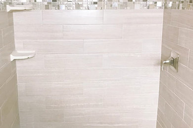 Example of a mid-sized trendy beige tile and porcelain tile beige floor bathroom design in Atlanta with beige walls