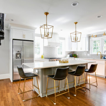 Elegant White Kitchen with Gold Accents and Spiral Staircase