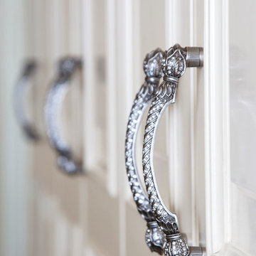 Custom Couture Master Closet with White Recessed Panel Cabinetry