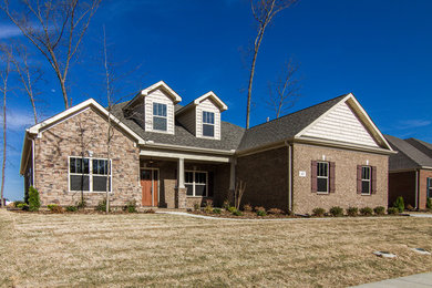 Inspiration for a craftsman two-story brick exterior home remodel in Other