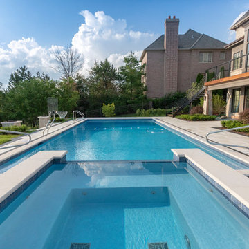 Burr Ridge Lap Pool with Raised Hot Tub and Waterfall