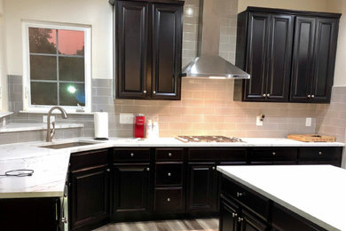 Kitchen - modern gray floor kitchen idea in Raleigh with an undermount sink, quartz countertops, gray backsplash, ceramic backsplash, stainless steel appliances and white countertops