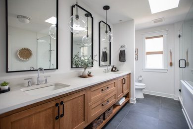 Large transitional master white tile and subway tile slate floor, gray floor and double-sink double shower photo in Chicago with shaker cabinets, medium tone wood cabinets, a two-piece toilet, an undermount sink, quartz countertops, a hinged shower door, white countertops and a built-in vanity