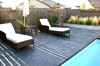 Minimalist concrete and rectangular pool photo in Sacramento