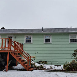 Metal Roof on Split-level Home - Roofing And Gutters