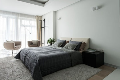 Inspiration for a mid-sized contemporary master bedroom in Moscow with white walls.