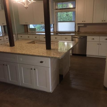 Kitchen remodel with white shaker cabinets and quartz counter tops.