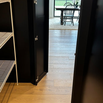 Black and Maple Wheat Kitchen with Brass Banded Hood