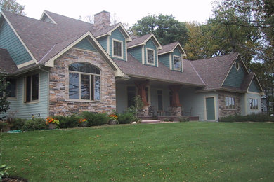 Mid-sized arts and crafts blue two-story mixed siding exterior home photo in Minneapolis with a shingle roof