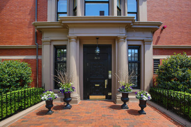 Large elegant red one-story brick apartment exterior photo in Boston