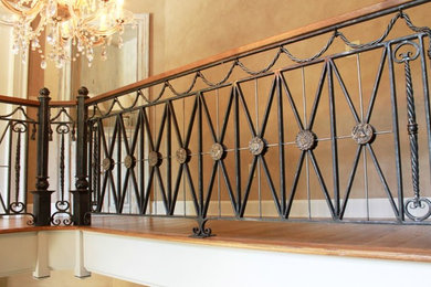 Inspiration for a mid-sized timeless wooden u-shaped staircase remodel in Huntington with painted risers