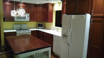 Showplace Wood Products Cabinetry Solid Surface Tops and Wood Island top.