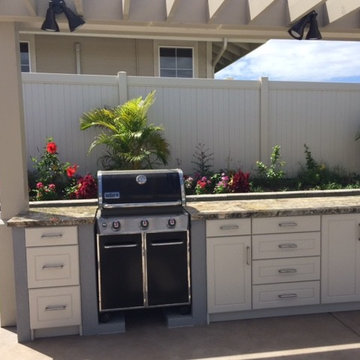 Outdoor BBQ area at pool pergola