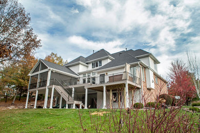 Inspiration for a huge transitional backyard outdoor kitchen deck remodel in Other with a roof extension