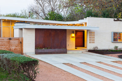 This is an example of a midcentury exterior in Austin.