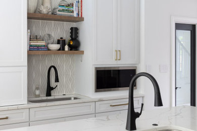 Inspiration for a large transitional kitchen remodel in DC Metro with marble countertops and an island