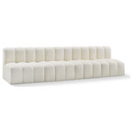 Meridian Furniture - Arc Vegan Leather Upholstered 4-Pc. Modular Sofa, Cream - Unleash modern opulence with the Arc Vegan Leather 4pc. Sectional. Crafted for the modern connoisseur, this Sectional injects an air of refined luxury into any space. Its sleek silhouette, upholstered in supple cream vegan leather, exudes timeless sophistication while the deep channel tufting adds textural intrigue, further elevating the chair's visual appeal. The modular design makes it a versatile chameleon, effortlessly adapting to your evolving needs and preferences. Whether you envision it gracing a chic living room corner, basking in the glow of a bedroom window, or adding a touch of drama to a home office, the Arc seamlessly complements your unique interior aesthetic.
