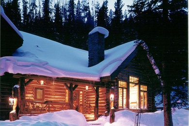 Mountain style two-story wood exterior home photo in Other