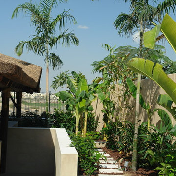 Thatch & timber is the is the focal point of this beautifully landscaped garden