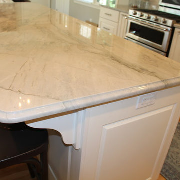 Sea Pearl Quartzite and White Cabinets